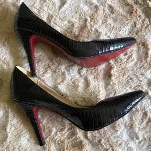 CHRISTIAN LOUBOUTIN black python pointed toe pumps